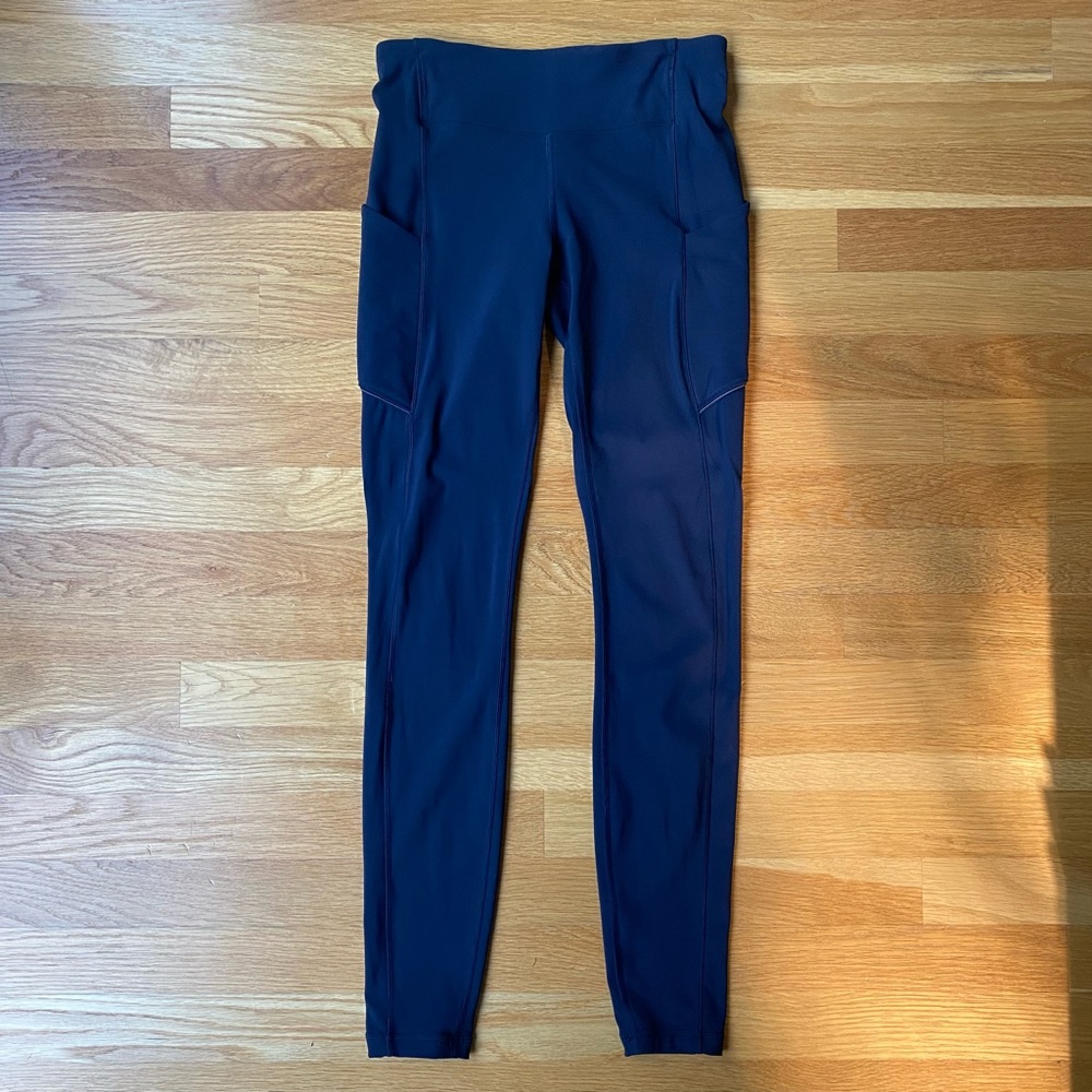 Lululemon high rise leggings, side pockets, zip back pocket in navy blue size 4